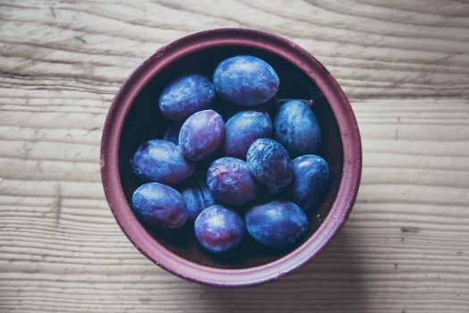 Prunes soften stools and increase the bowel movements due to their high fiber content and laxative properties, primarily sorbito